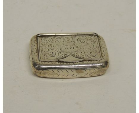 A Victorian silver snuff box having scrolling foliate engraved decoration, the hinged lid engraved with initials "CM", with g