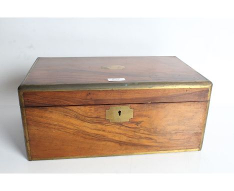 Victorian walnut and brass bound writing box, the hinged lid enclosing a leather inset slope (AF) and fitted inkwell and pen 