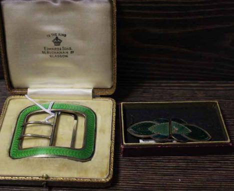 ART DECO GREEN GUILLOCHE ENAMEL AND SILVER BELT BUCKLE
marked for Birmingham, 34g, 6.5cm long, retailed by Edward & Sons, Gla