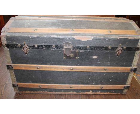 20TH CENTURY VINTAGE METAL BOUND TRAVEL TRUNK
of domed form, 57cm high, 90cm long, 49.5cm wide
The base of the trunk is comin