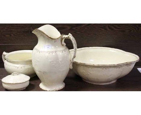 FOUR IVORY CERAMIC ITEMS
marked 'Oriental Ivory' with a seated asian figure, a wash basin and jug, a bowl and a lidded dish, 