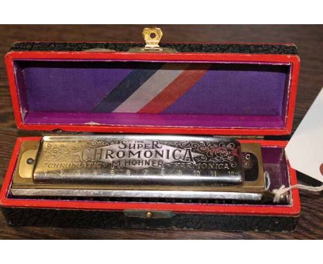 THE 'SUPER CHROMONICA' HARMONICA
in original box, box 16.5cm long 