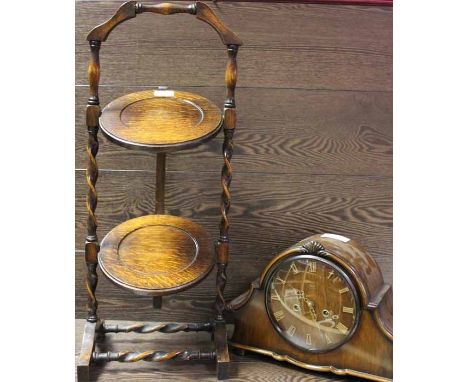 SMITH MAHOGANY MANTLE CLOCK
with wooden dial and Roman numerals, with original key; together with a two tier barley twist cak