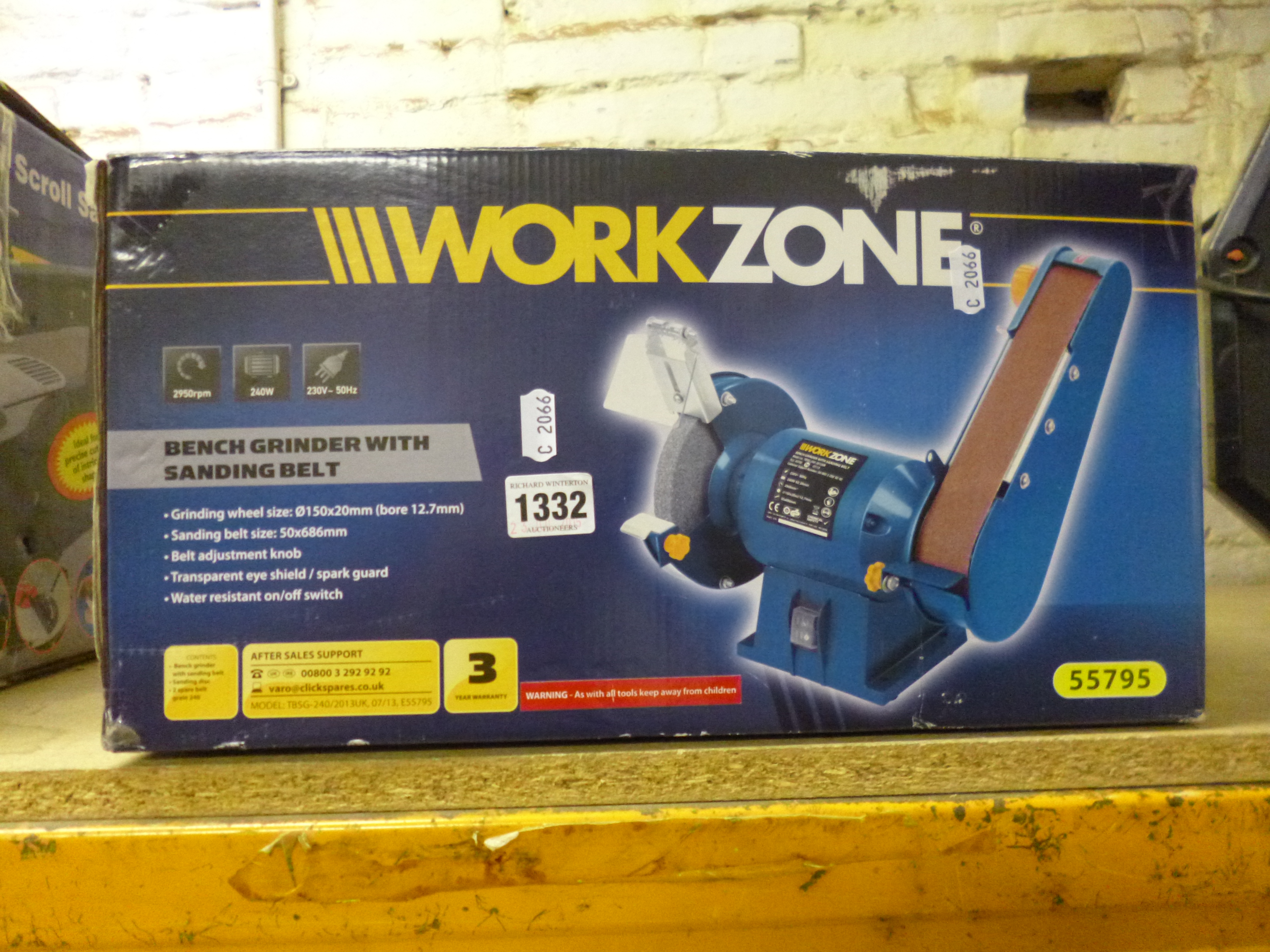 a boxed work zone bench grinder, with sand belt