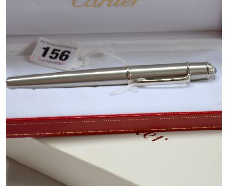 A CARTIER STYLO PLUME DIABOLO ROLLER BALL PEN, in brushed stainless steel, in original box and outer