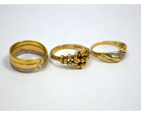 THREE RINGS, to include a Keeper ring, a bi-metal coloured diamond ring and a further band ring, hallmarks in two rings, ring