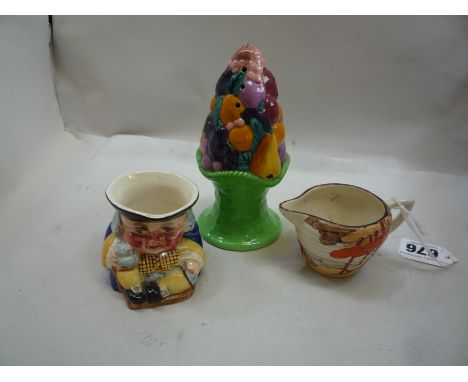 CLARICE CLIFF, A Newport Pottery Toby Salt and a Wilkinson & Co 'Bizarre' orange and brown trees in landscape small jug, heig