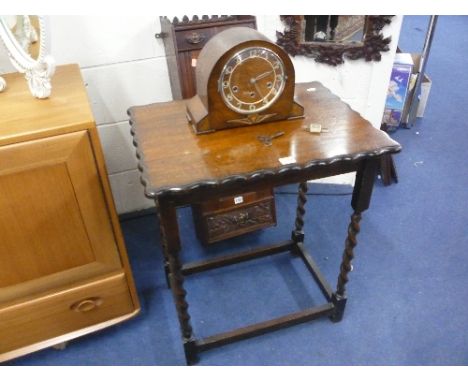 AN OAK BARLEY TWIST OCCASIONAL TABLE, and an oak cased mantle clock (pendulum and key) (2)