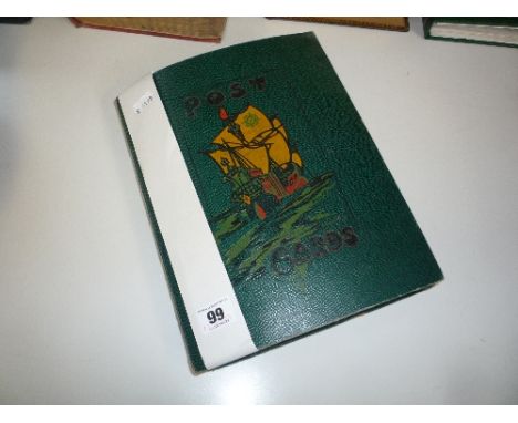 A POSTCARD ALBUM, containing a quantity of early 20th Century greeting cards, loosely inserted