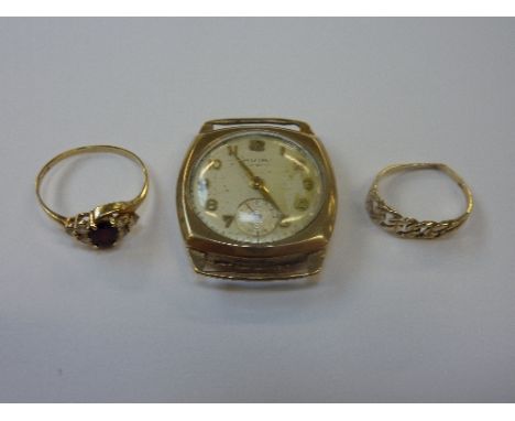 TWO RINGS, the first a garnet and cubic zirconia ring, together with a curb link ring together with a watch face