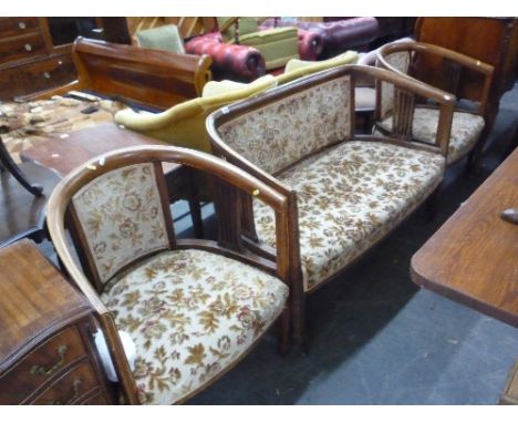 AN EDWARDIAN MAHOGANY INLAID THREE PIECE PARLOUR SUITE, comprising of a sofa and two armchairs