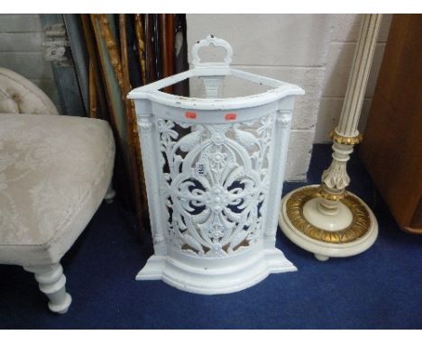 A VICTORIAN STYLE PAINTED CAST IRON CORNER STICK STAND