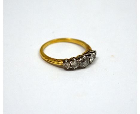 AN EARLY 20th CENTURY RING, with five graduated old cut diamonds to a fancy tapered band, estimated total diamond weight 1.00