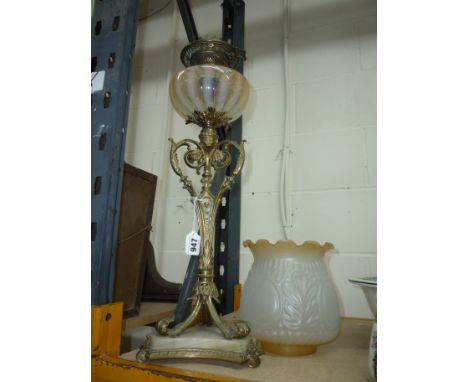 A BRASS OIL LAMP, with opaline glass well and glass shade