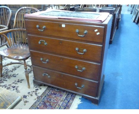 A GEORGIAN OAK CHEST, of four long drawers with caddy top and bracket feet supports