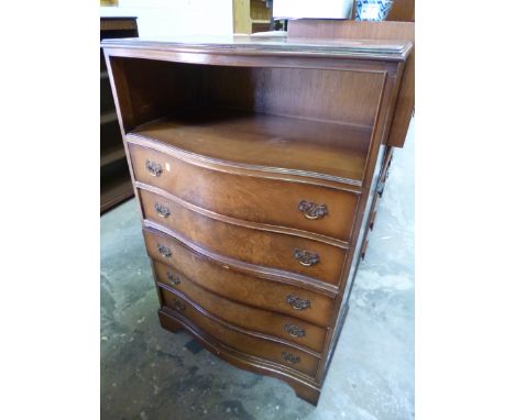 A TALL WALNUT SERPENTINE CHEST, of five long drawers with open shelf above and a walnut tea trolley (2)