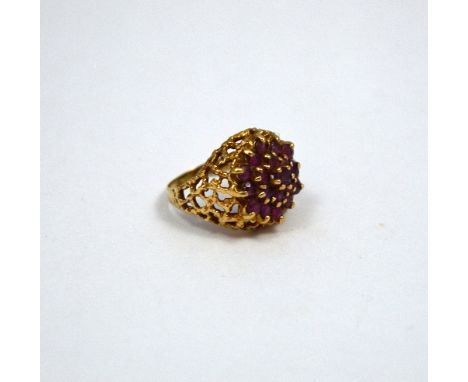 A 9CT GOLD DRESS RING, comprising of a pink topaz within a daisy shape cluster to the filigree domed sides, hallmarks for Lon