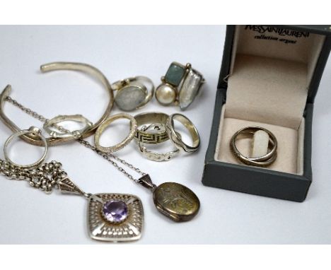 A COLLECTION OF SILVER JEWELLERY, to include rings, chain, locket and a Yves St Laurent silver band ring