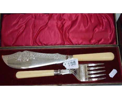 A BOXED FISH KNIFE AND FORK