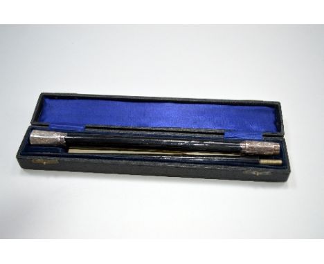 AN EBONISED AND SILVER MOUNTED SONGSTER BRIGADE CONDUCTORS BATON, London 1919, length 47cm, cased