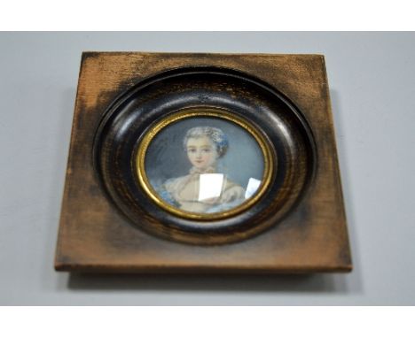 A 19TH CENTURY MINIATURE, portrait of a young lady, tondo, on ivory, 5.5cm