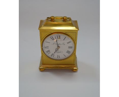 A BRASS MANTLE CLOCK, the enamelled dial inscribed M Qualters Esq / Walsall, 18cm excluding handle
