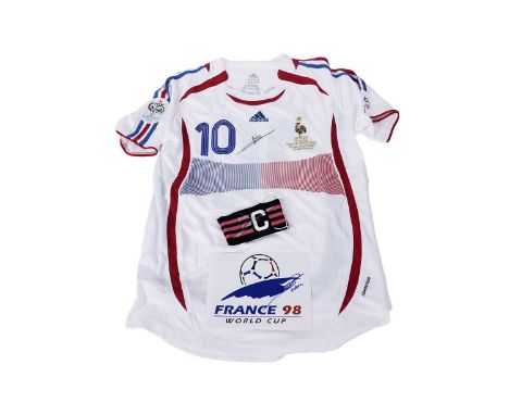 An autographed Adidas France World Cup 2006 strip, signed by Zinedine Zidane; together with a signed captain’s armband; and a