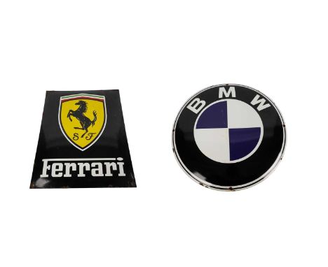 An enamel Ferrari sign, with the crest to the centre and 'Ferrari' in white below, on a black ground, 50.5 x 40cms wide; and 