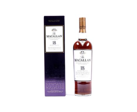 A bottle of The Macallan 18 Year Old Highland Single Malt Scotch Whisky, exclusively matured in selected sherry oak casks fro