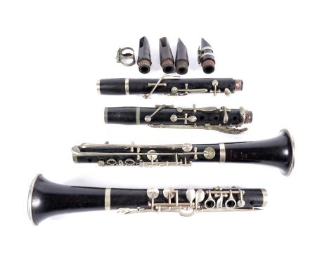 A Hawkes Excelsior Sonorous Bb clarinet in Grenadilla wood, nickel plated keys; and another stamped Pagot et Cie, in vintage 