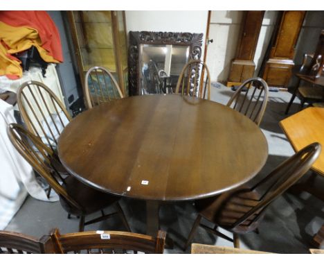    An Ercol Drop Leaf Dining Table &amp; Six Spindle Back Chairs                       