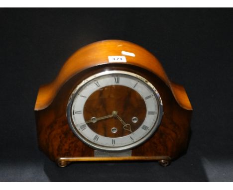     An Early 20thc Polished Mantel Clock With Circular Silvered Dial                