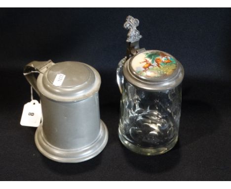     A Glass Tankard With Pewter Lid &amp; Inset Ceramic Plaque, Together With A Further Lidded Pewter Tankard                