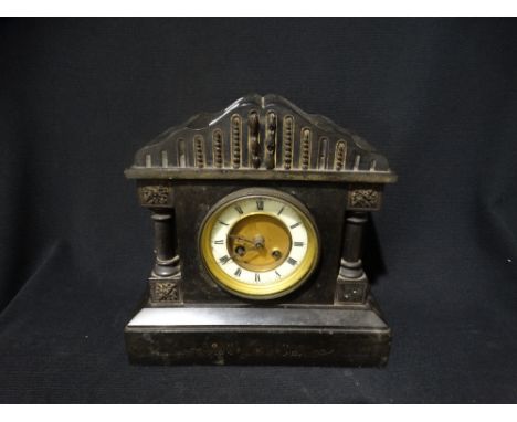     A Victorian Black Marble Encased Mantel Clock With Circular Dial                