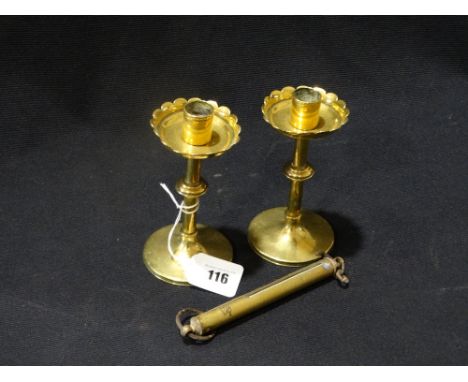     A Pair Of Circular Based Brass Candle Holders In The Style Of Christopher Dresser, Together With A Brass Spring Balance S