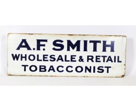  An early 20th century enamel advertising sign for 'A F Smith - Wholesale & Retail Tobacconists':, blue text on white ground,