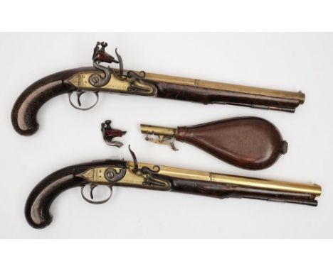 Knubley, London, a pair of late 18th century flintlock pistols:  with 29.5cm. sighted brass barrels, fully stocked with ramro