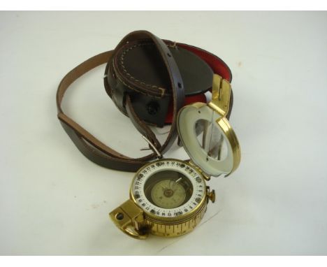 A brass cased MKV style compass in a later leather case:..