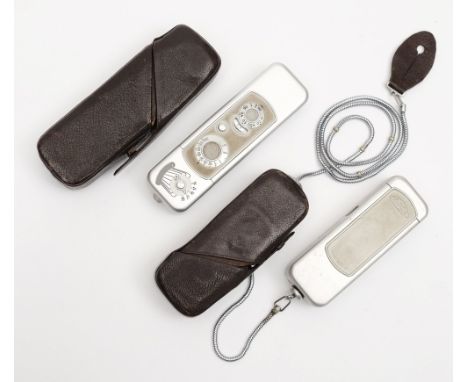 Two Minox subminiature cameras:, both with Complain 15mm lenses , one having light meter to one end, both with original leath