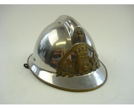 A French chrome fireman's helmet for Pontivy fire station:, of typical form with brass badge and leather liner.