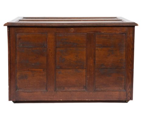 A 19th Century oak silversmith's / jewelers trunk:, of panelled construction, the fall front enclosing an interior partly fit