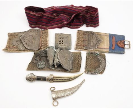 Three sections of a Middle Eastern crossbelt, together with a whitemetal buckle and a later miniature Jambiya in scabbard:.