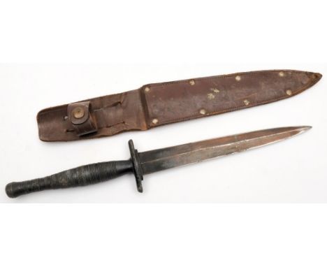 A Fairbairn-Skyes style fighting knife:, double edged tri-form blade over die cast hilt and ribbed grip, in a brown leather s