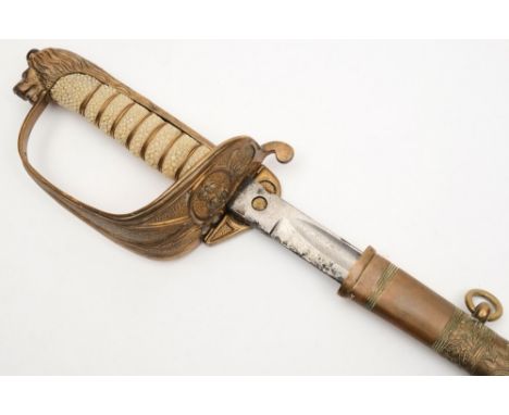 A George V  Royal Naval Officer's dress sword:, the straight single edged blade with acid etched decoration over gilt brass h