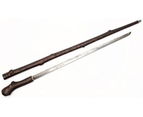 A Japanese sword stick:, the double fullered straight blade signed/inscribed to either side over brass mount and naturalistic