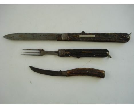 A 19th century folding knife by Taylor, together with a folding fork and one other knife:, all three with antler handles, the