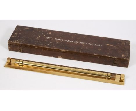 An Admiralty pattern rolling ruler: by Harling, Patt No 160100, with War Office arrow, contained in a wood case.