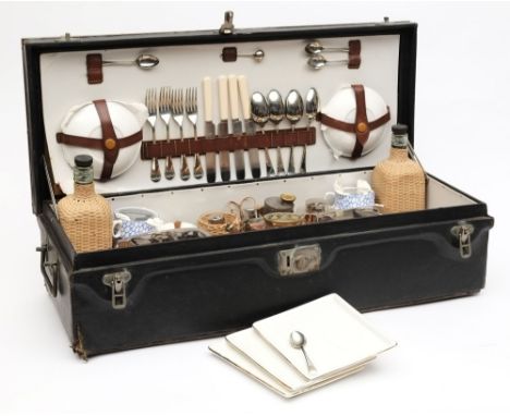 A Coracle running board picnic set:, the brass bound top with ridged tread enclosing a fitted interior with earthenware cups,