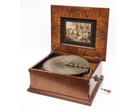 A Nicole Freres polyphon: with floral inlaid and crossbanded lid, the lid interior inset with an engraving of putti playing m