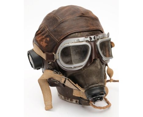 A WWII period brown leather flying helmet, goggles and face mask:, the helmet retaining original headphones stamped '10A/1346